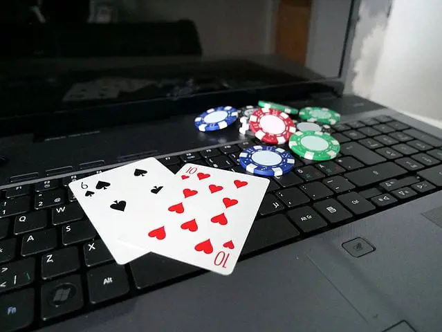 Laptop_with_poker_cards_and_poker_chips_6