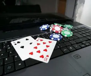 Laptop_with_poker_cards_and_poker_chips_7_0