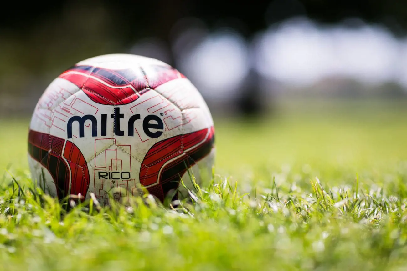 mitre-macro-football-ball-grass-wallpaper-scaled